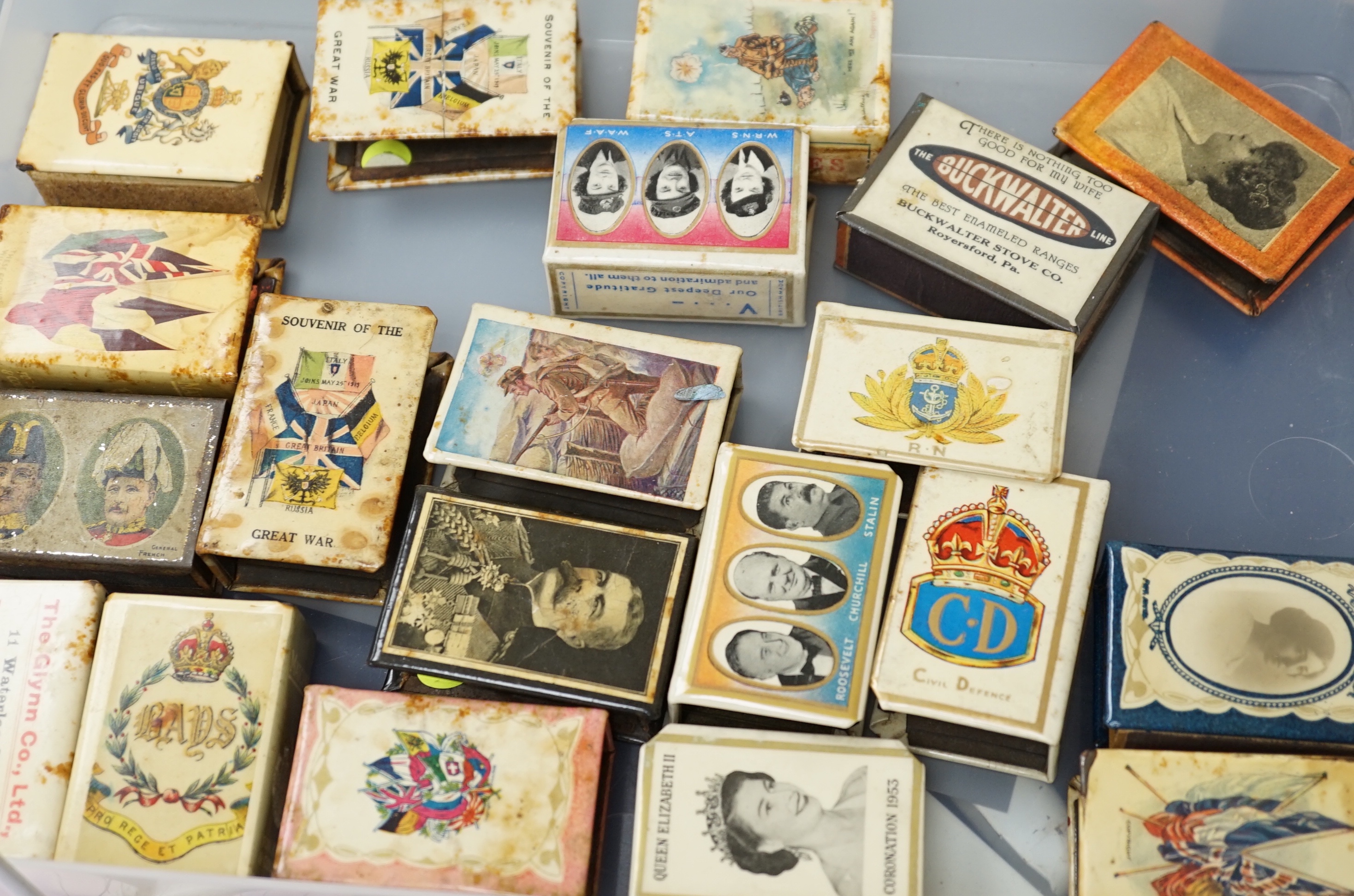 A collection of early and mid 20th century WWII match box holders